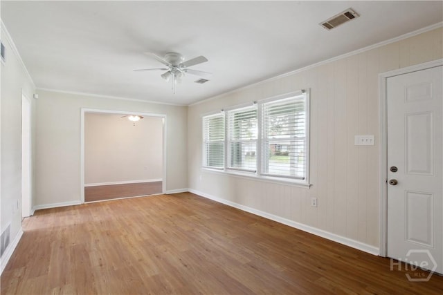 2301 Pinetree Rd, Savannah, GA 31404 - spare room with ceiling fan, ornamental molding, wood finished floors, and baseboards