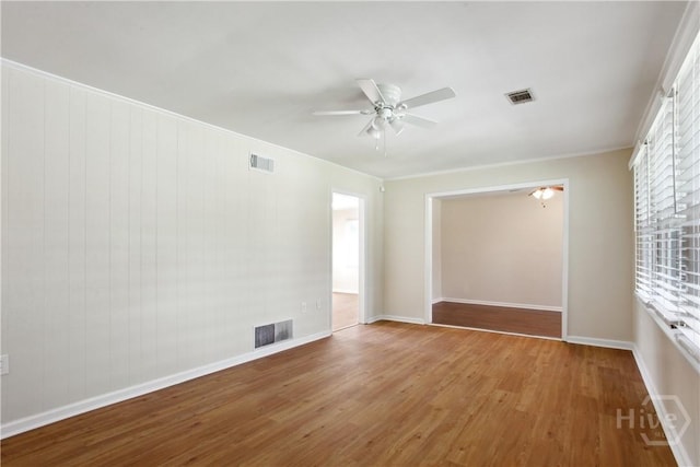 2301 Pinetree Rd, Savannah, GA 31404 - spare room featuring a ceiling fan, wood finished floors, baseboards, and crown molding