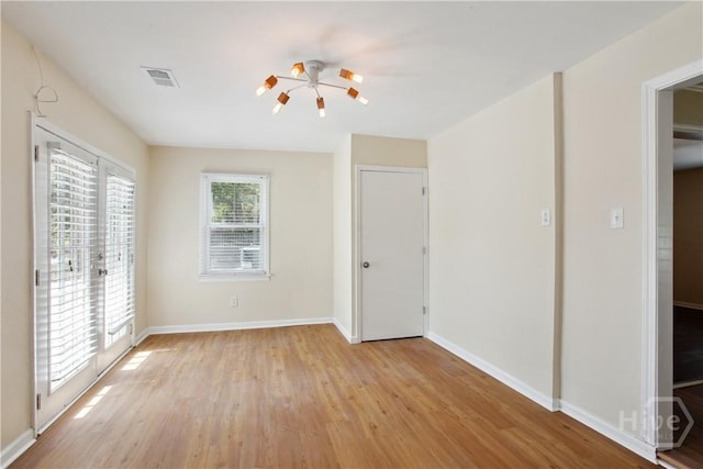 2301 Pinetree Rd, Savannah, GA 31404 - unfurnished bedroom with light wood-style flooring, access to exterior, and baseboards