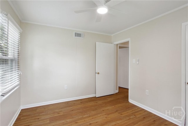 2301 Pinetree Rd, Savannah, GA 31404 - unfurnished room with light wood-style floors, ceiling fan, crown molding, and baseboards