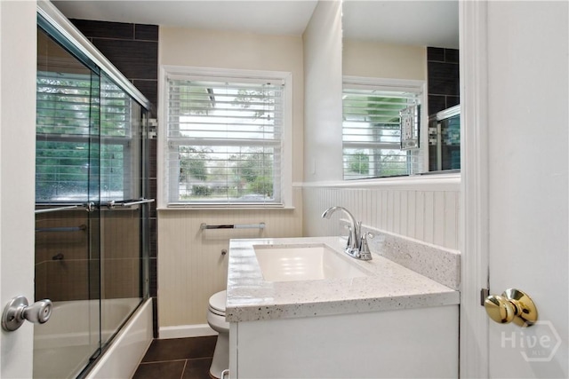 2301 Pinetree Rd, Savannah, GA 31404 - bathroom with toilet, vanity, tile patterned floors, and combined bath / shower with glass door