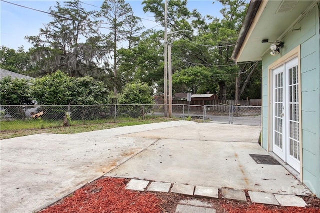 2301 Pinetree Rd, Savannah, GA 31404 - fenced backyard featuring french doors and a patio area