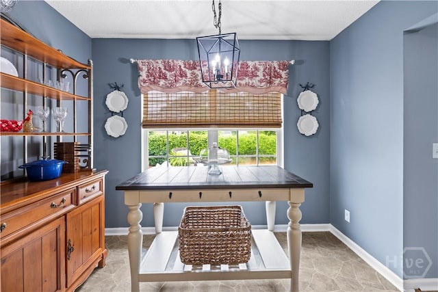 267 Jasper Ln, Rincon, GA 31326 - home office with a chandelier, light tile patterned flooring, and baseboards
