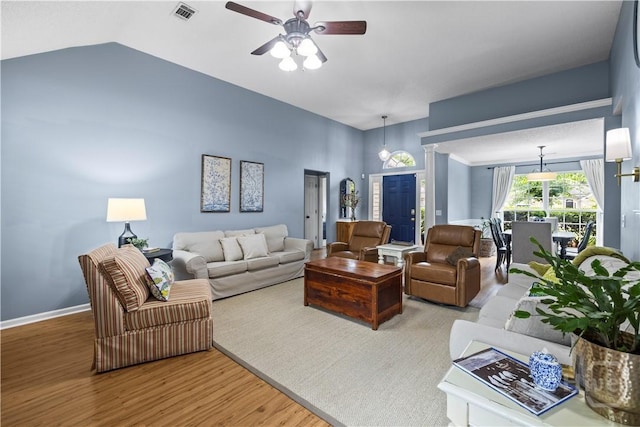 267 Jasper Ln, Rincon, GA 31326 - living area featuring a ceiling fan, wood finished floors, vaulted ceiling, and baseboards