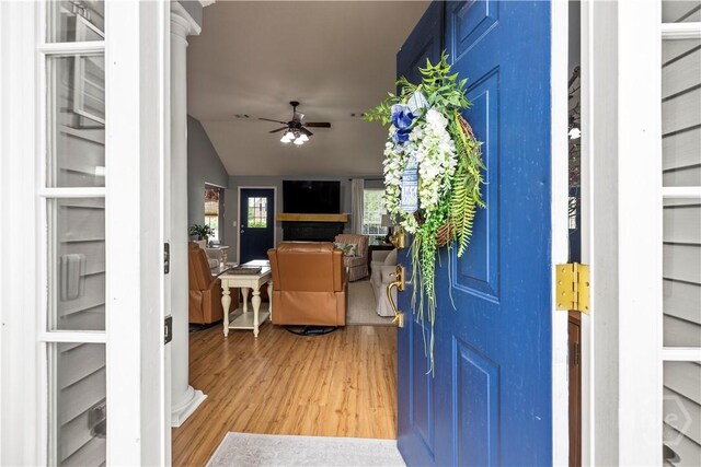 267 Jasper Ln, Rincon, GA 31326 - entryway featuring a ceiling fan, light wood finished floors, a fireplace, and vaulted ceiling