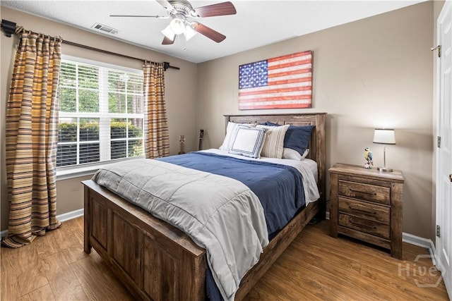 267 Jasper Ln, Rincon, GA 31326 - bedroom featuring wood finished floors, baseboards, and a ceiling fan