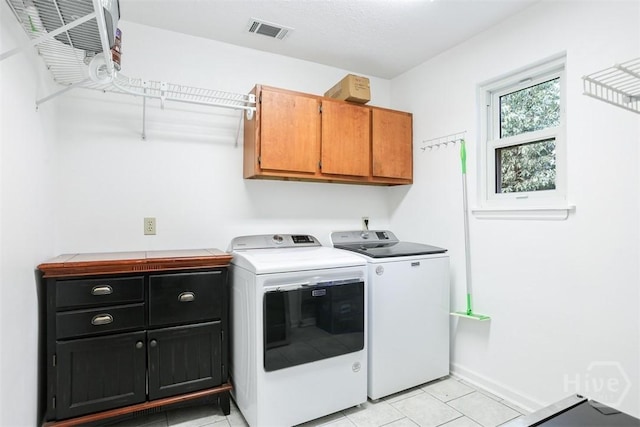 15 Ramble Rd, Statesboro, GA 30458 - laundry area with cabinet space, separate washer and dryer, light tile patterned floors, and baseboards