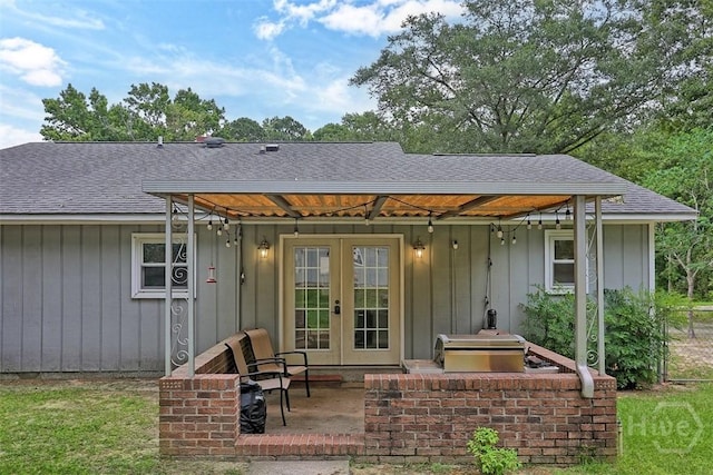15 Ramble Rd, Statesboro, GA 30458 - view of front of home featuring french doors, a shingled roof, and a patio area