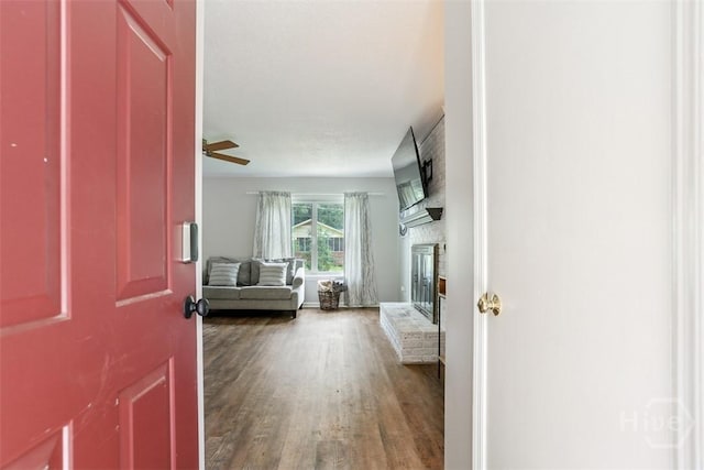 15 Ramble Rd, Statesboro, GA 30458 - foyer featuring wood finished floors, a brick fireplace, and ceiling fan