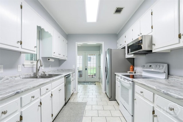 15 Ramble Rd, Statesboro, GA 30458 - kitchen with appliances with stainless steel finishes, a sink, white cabinets, and light countertops