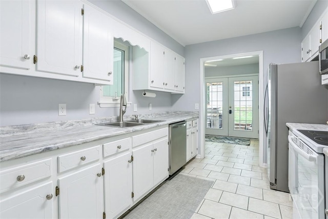 15 Ramble Rd, Statesboro, GA 30458 - kitchen featuring stainless steel appliances, a sink, white cabinets, french doors, and light countertops
