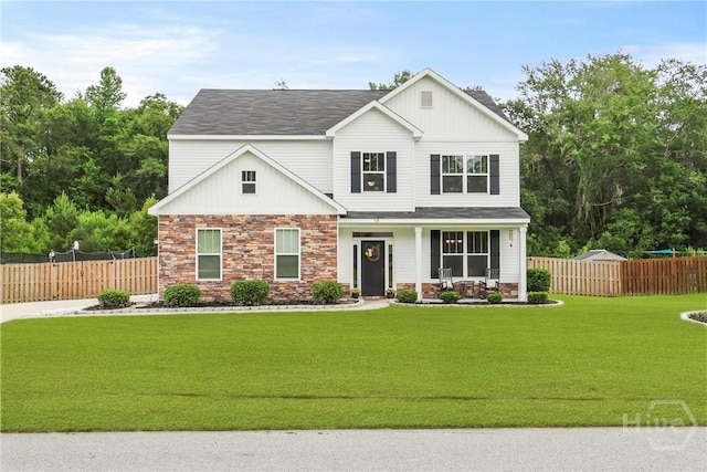 108 Summer Station Dr, Guyton, GA 31312 - view of front of property featuring covered porch, stone siding, and roof with shingles