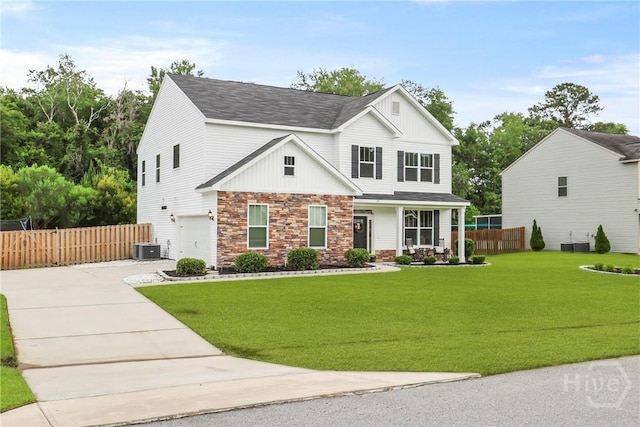108 Summer Station Dr, Guyton, GA 31312 - view of front of house featuring a garage, driveway, stone siding, central AC, and board and batten siding