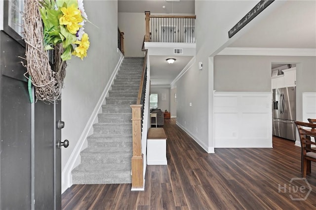 108 Summer Station Dr, Guyton, GA 31312 - foyer featuring stairway, crown molding, dark wood-type flooring, baseboards, and a high ceiling