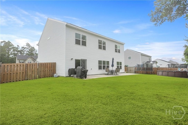 108 Summer Station Dr, Guyton, GA 31312 - back of property with a patio