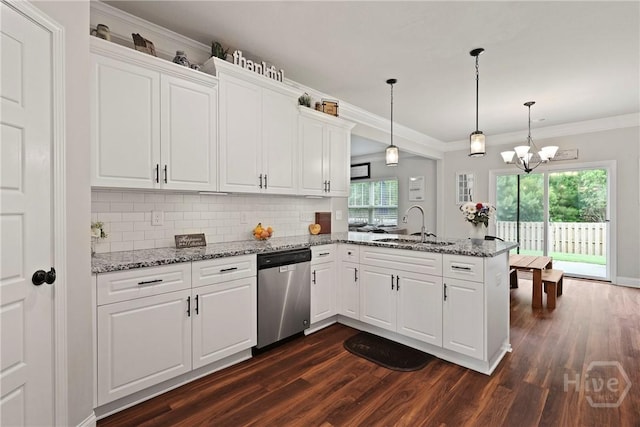 108 Summer Station Dr, Guyton, GA 31312 - kitchen with stainless steel dishwasher, a sink, a peninsula, dark wood-style floors, and tasteful backsplash