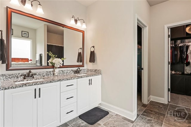 108 Summer Station Dr, Guyton, GA 31312 - bathroom with double vanity, baseboards, and a spacious closet