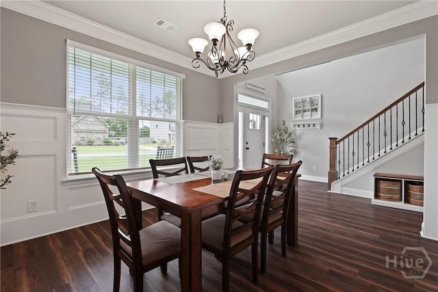 108 Summer Station Dr, Guyton, GA 31312 - dining room featuring a chandelier, a decorative wall, wood finished floors, ornamental molding, and stairs