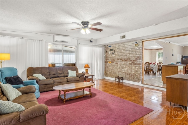 114 Piercefield Dr, Richmond Hill, GA 31324 - tiled living area featuring a wall mounted air conditioner, a ceiling fan, a textured ceiling, and brick wall