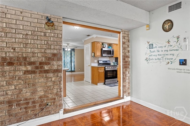 114 Piercefield Dr, Richmond Hill, GA 31324 - kitchen with appliances with stainless steel finishes, a textured ceiling, ceiling fan, light countertops, and brown cabinetry