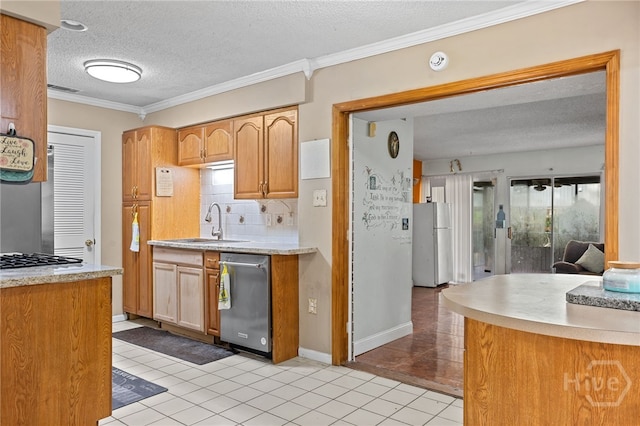114 Piercefield Dr, Richmond Hill, GA 31324 - kitchen featuring appliances with stainless steel finishes, light tile patterned floors, a textured ceiling, light countertops, and tasteful backsplash