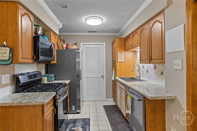 114 Piercefield Dr, Richmond Hill, GA 31324 - kitchen with stainless steel appliances, backsplash, light countertops, brown cabinets, and a textured ceiling