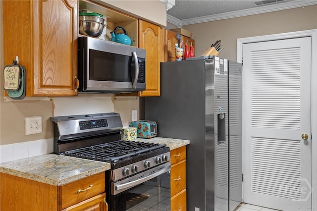 114 Piercefield Dr, Richmond Hill, GA 31324 - kitchen with stainless steel appliances, ornamental molding, brown cabinets, and light tile patterned flooring
