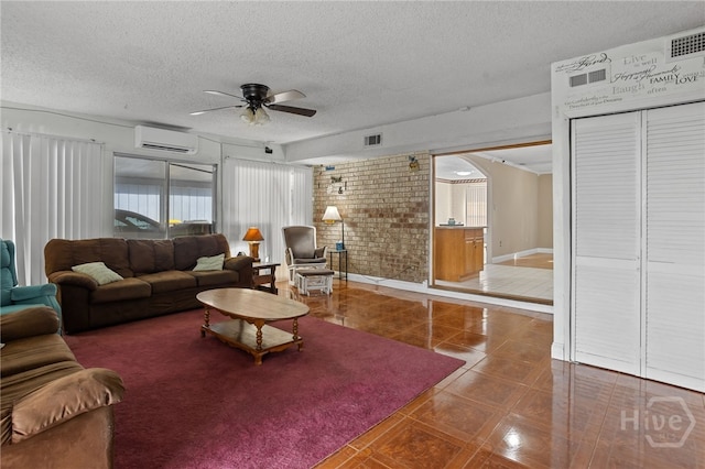 114 Piercefield Dr, Richmond Hill, GA 31324 - living room featuring a wall mounted air conditioner, ceiling fan, a textured ceiling, and brick wall