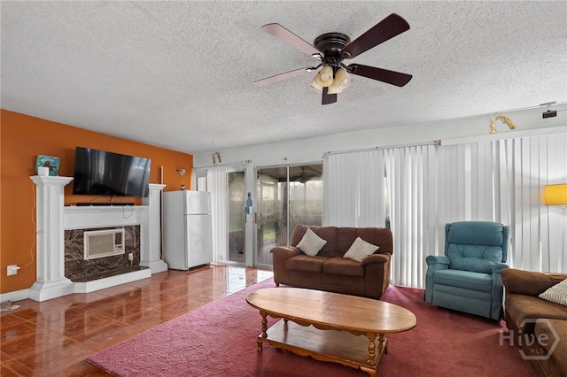 114 Piercefield Dr, Richmond Hill, GA 31324 - living area with a textured ceiling, a ceiling fan, heating unit, and a fireplace