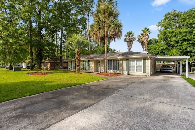 114 Piercefield Dr, Richmond Hill, GA 31324 - ranch-style home featuring concrete driveway, a front lawn, and an attached carport