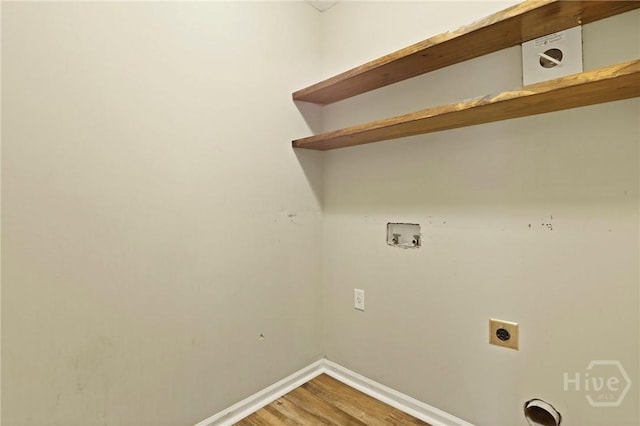 93 Veranda Trl, Midway, GA 31320 - washroom with electric dryer hookup, washer hookup, baseboards, and light wood-style floors
