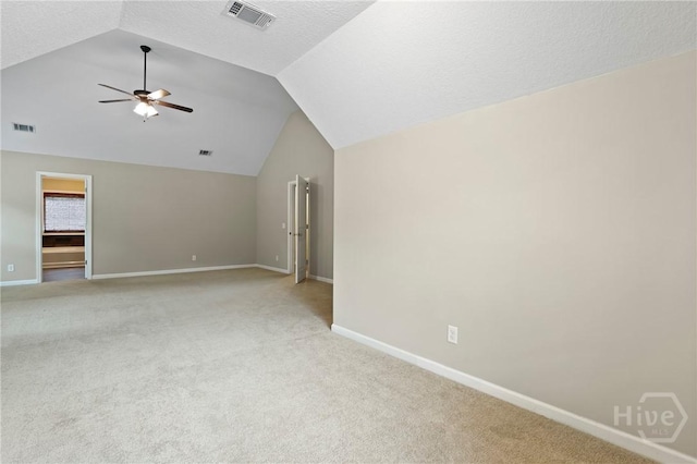 93 Veranda Trl, Midway, GA 31320 - empty room featuring a ceiling fan, light colored carpet, vaulted ceiling, and baseboards