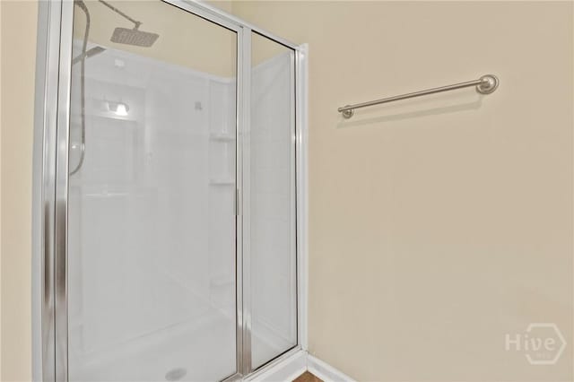 93 Veranda Trl, Midway, GA 31320 - bathroom featuring a stall shower and baseboards