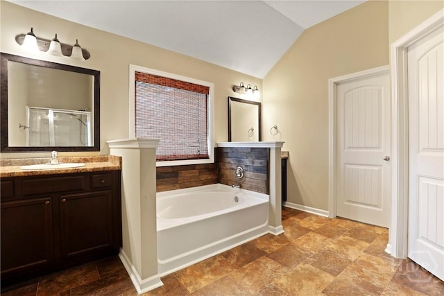 93 Veranda Trl, Midway, GA 31320 - bathroom featuring vaulted ceiling, vanity, a bath, a stall shower, and baseboards
