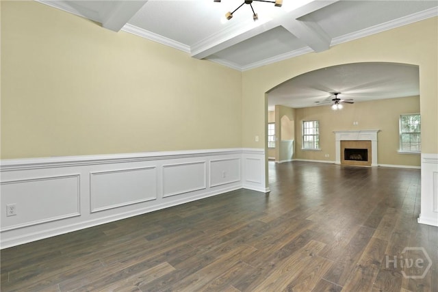 93 Veranda Trl, Midway, GA 31320 - unfurnished living room featuring arched walkways, a ceiling fan, beam ceiling, dark wood-style floors, and a fireplace