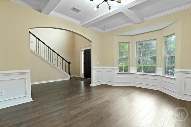 93 Veranda Trl, Midway, GA 31320 - unfurnished living room featuring beam ceiling, arched walkways, healthy amount of natural light, dark wood-style flooring, and a chandelier