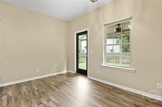 93 Veranda Trl, Midway, GA 31320 - empty room with wood finished floors and baseboards