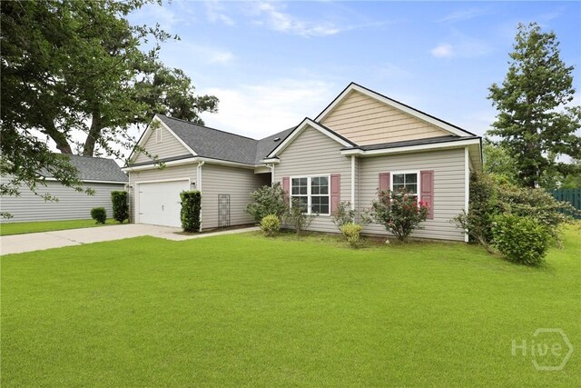 7 Sailmaker Ln, Richmond Hill, GA 31324 - view of front of property with driveway, an attached garage, and a front yard