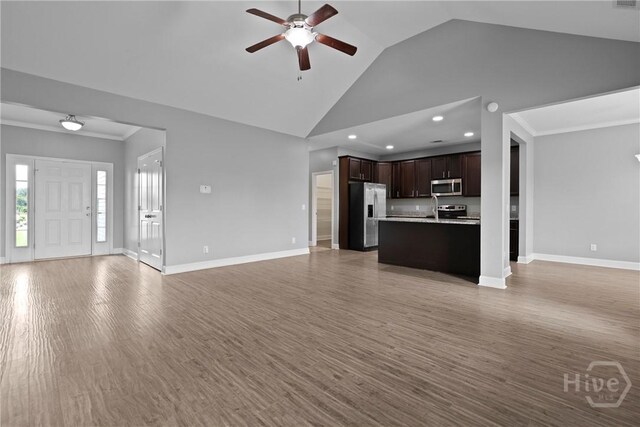 7 Sailmaker Ln, Richmond Hill, GA 31324 - unfurnished living room featuring ceiling fan, recessed lighting, baseboards, light wood finished floors, and high vaulted ceiling