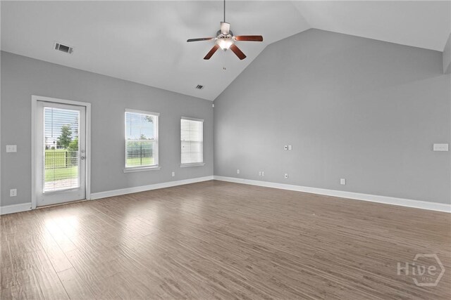 7 Sailmaker Ln, Richmond Hill, GA 31324 - unfurnished room with ceiling fan, wood finished floors, high vaulted ceiling, and baseboards