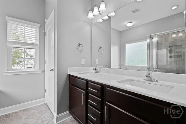 7 Sailmaker Ln, Richmond Hill, GA 31324 - full bath featuring double vanity, baseboards, and a tile shower