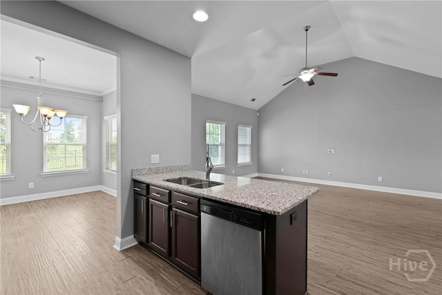 7 Sailmaker Ln, Richmond Hill, GA 31324 - kitchen featuring stainless steel dishwasher, open floor plan, a sink, plenty of natural light, and vaulted ceiling