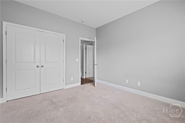 7 Sailmaker Ln, Richmond Hill, GA 31324 - unfurnished bedroom featuring carpet flooring, baseboards, and a closet