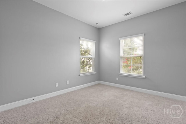 7 Sailmaker Ln, Richmond Hill, GA 31324 - unfurnished room with light colored carpet, healthy amount of natural light, and baseboards