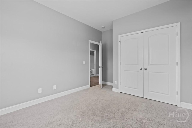 7 Sailmaker Ln, Richmond Hill, GA 31324 - unfurnished bedroom with carpet floors, a closet, and baseboards