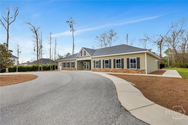 7 Sailmaker Ln, Richmond Hill, GA 31324 - view of front of property with stone siding and french doors