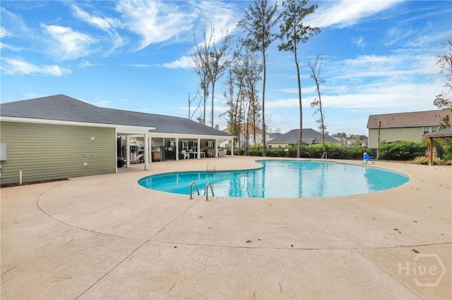 7 Sailmaker Ln, Richmond Hill, GA 31324 - community pool featuring a patio area