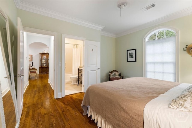 10 Cedar View Dr, Savannah, GA 31410 - bedroom with arched walkways, ornamental molding, dark wood-type flooring, ensuite bathroom, and baseboards