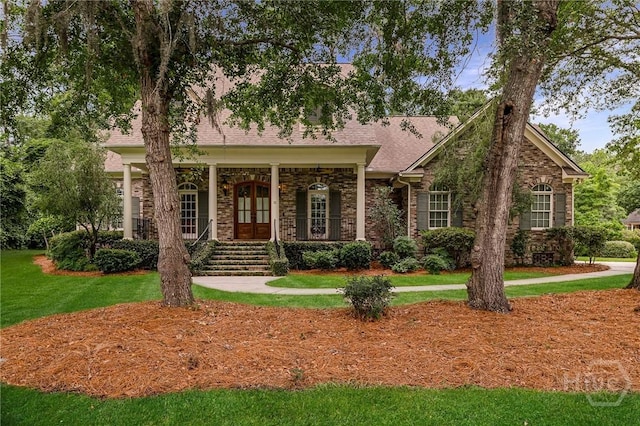 10 Cedar View Dr, Savannah, GA 31410 - view of front of home featuring covered porch, a front lawn, and brick siding