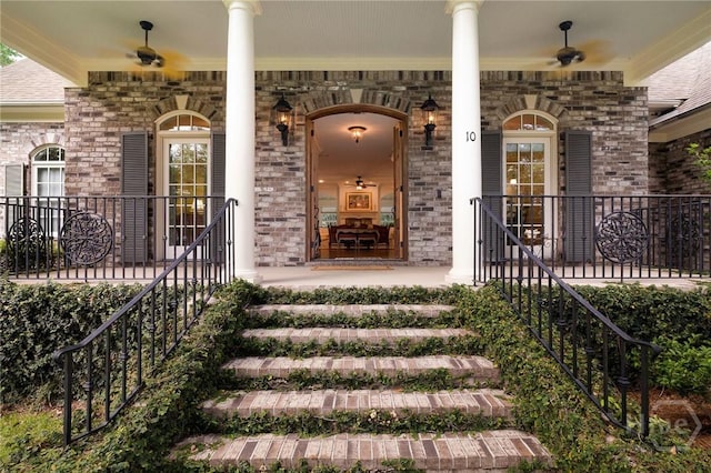 10 Cedar View Dr, Savannah, GA 31410 - view of exterior entry featuring a porch, ceiling fan, and brick siding
